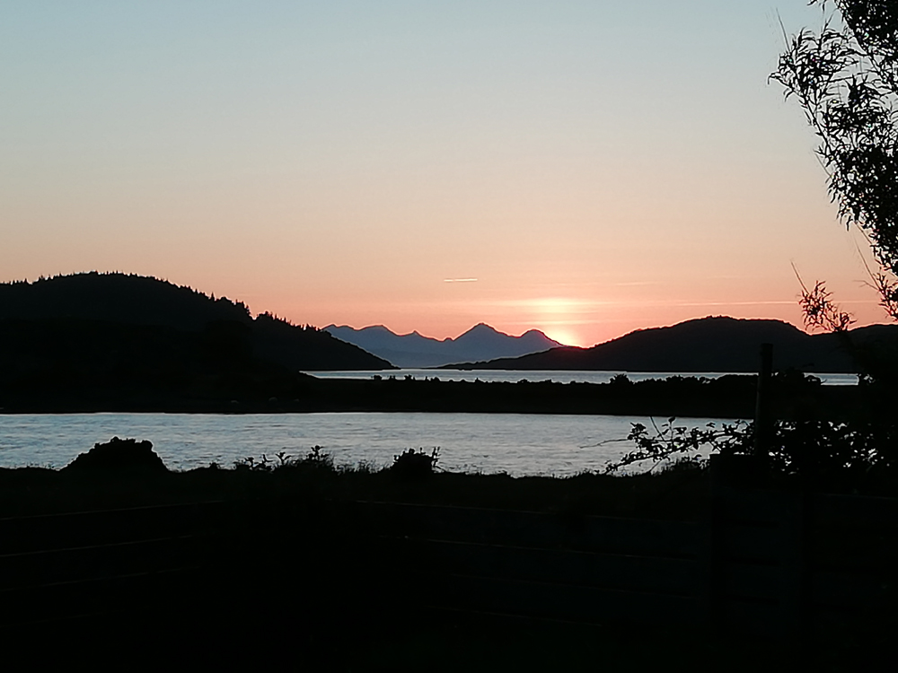 Sunset from Self catering caravans on shore of Arivegaig Bay, Ardnamurchan Scotland